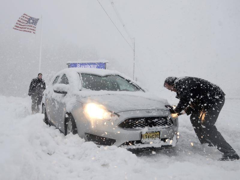 Another snowstorm has hit the northeastern US, cancelling flights and causing havoc for commuters.