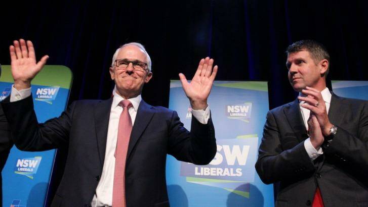 Prime Minister Malcolm Turnbull and Premier Mike Baird at the NSW Liberal Party State Council meeting.  Photo: Louise Kennerley