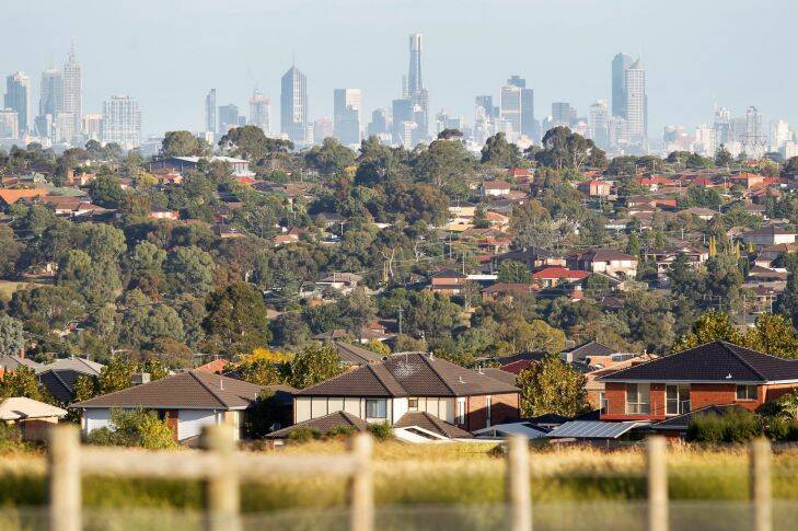 View of the Melbourne city skyline from Mickleham Road in Greenvale. Generic urban sprawl, urban development, new housing estate, outer suburbs, housing developments, urban fringe, rooftops, green wedge, rural fringe, city planning, commuter suburbs. Picture by PAUL ROVERE / THE AGE. 31 March 2011. NEWS