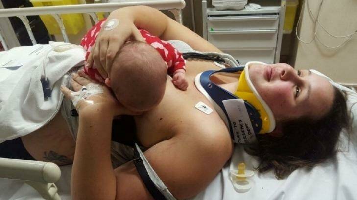 Danni Bett breastfeeding two-month-old Indi Nathan in Christchurch Hospital after being in a car crash.

