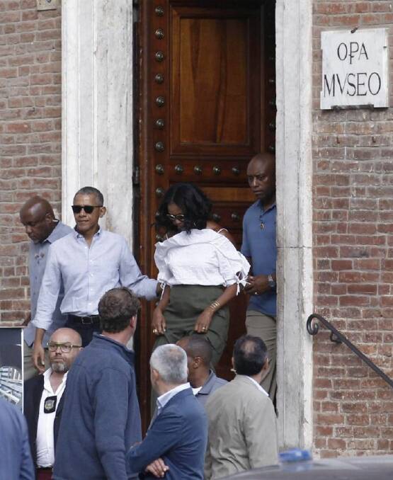 US former President Barack Obama and his wife Michelle leave the Museum of Opera, one of the oldest private museums in Italy, during their visit to Siena, Tuscany region, Italy, Monday, May 22, 2017. The Obamas arrived in Tuscany last Friday for a six-day holiday. (Fabio Di Pietro/ANSA via AP)