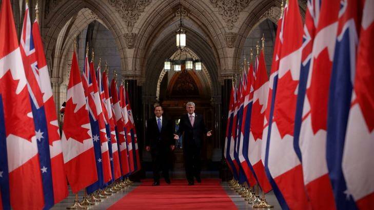 Prime Minister Tony Abbott and Canadian Prime Minister Stephen Harper walk the Hall of Honour earlier this year. Photo: Andrew Meares