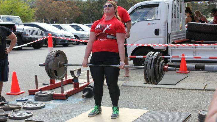 Asha Tracey holds 16 national records in powerlifting and strongwoman disciplines.
