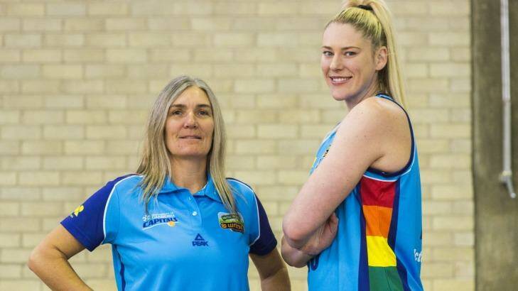 Canberra Capitals coach Carrie Graf with Lauren Jackson, showing off the team's new rainbow uniform. Photo: Rohan Thomson