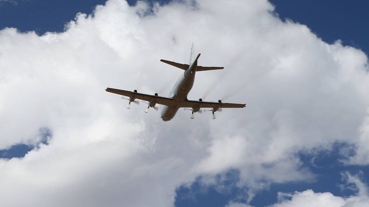 A Royal Australian Air Force P3 Orion takes off from Pearce air base to recommence a search for possible debris on March 21, 2014 in Perth, Australia. Photo: Getty Images.