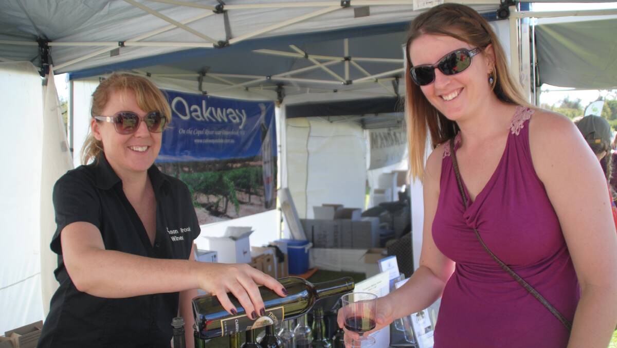Melissa Foster with Mel Smith of Darwin, checking out the local gourmet wines.