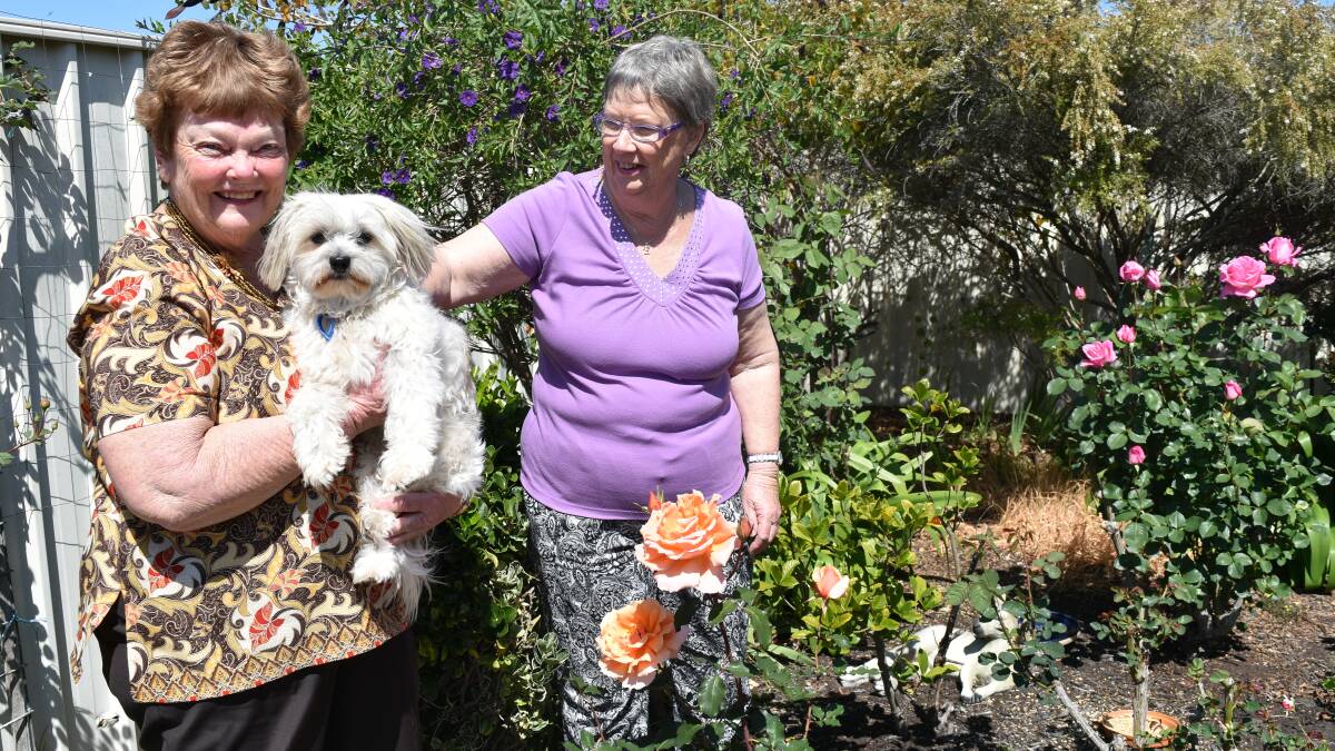 Residents Barbara Fleay and Estelle Jay enjoying their garden. 