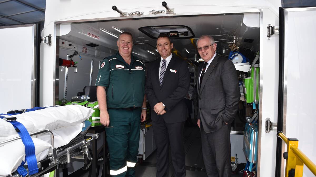 Perth area manager Phil Townsend and St John Ambulance service director Iain Langridge with St John Ambulance CEO Tony Ahern in the new patient transfer vehicle. 