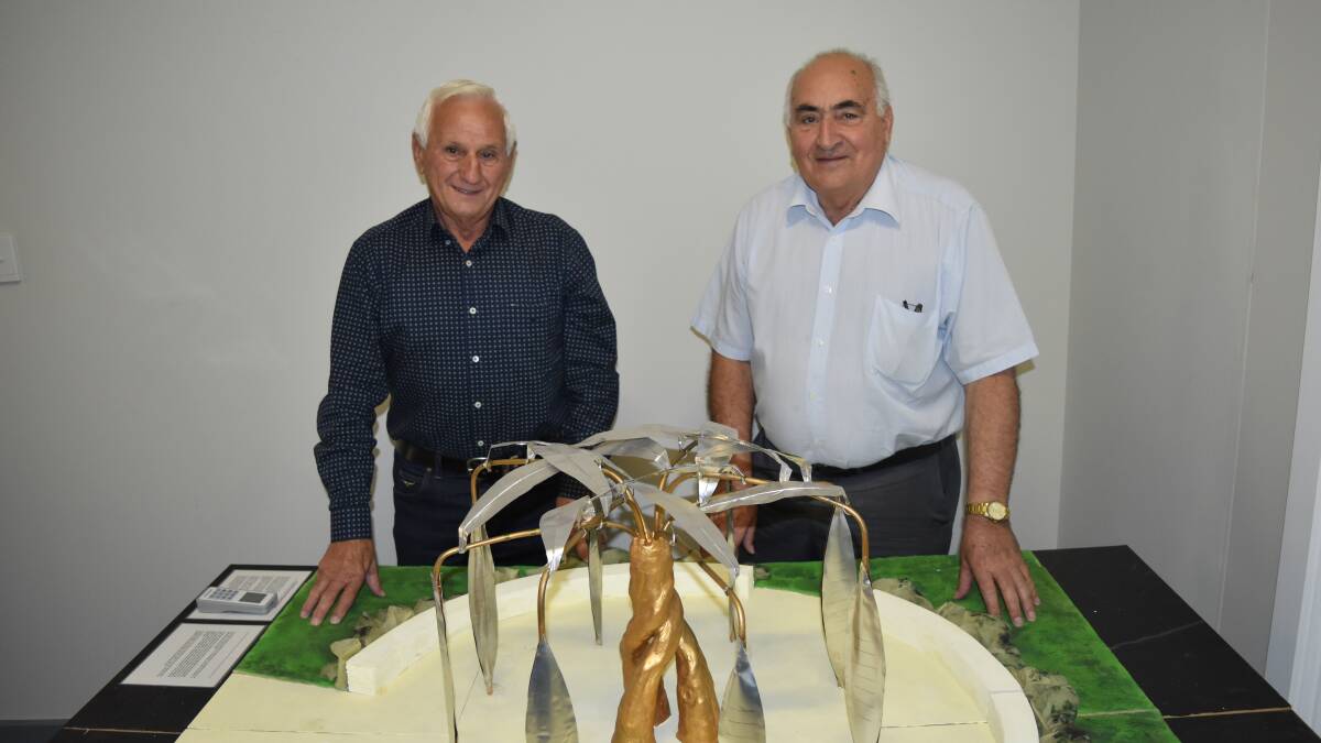 Lui Tuia and Charlie Martella with a model of the memorial.