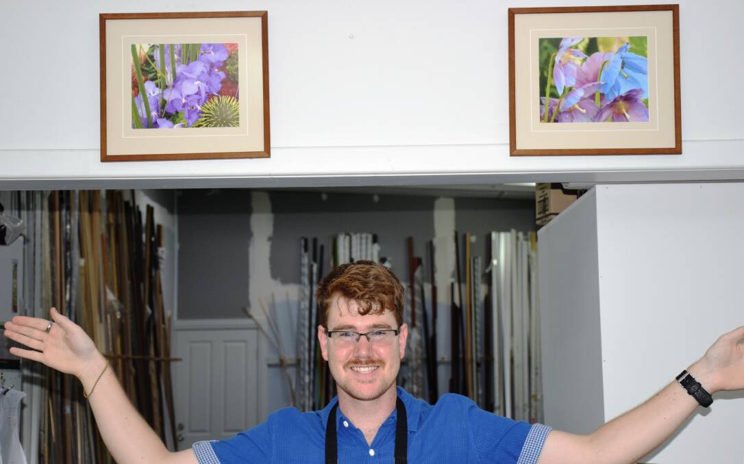 Sam Everitt and his “Florals in Frames” displayed at Southern Picture Framers.