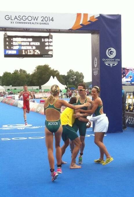 Bunbury triathlete Ryan Bailie embraced by fellow Australian's Emma Jackson, Aaron Royle and Emma Moffat as he crossed the line in the team triathlon event at the Commonwealth Games in Glasgow to claim a bronze medal. Image courtesy of twitter: @TraithlonLIVE.