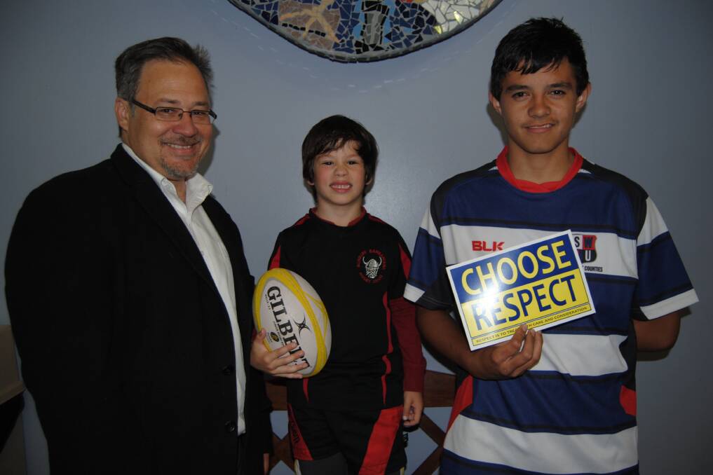 President of South West Junior Rugby Union Dieter Kalle with junior players, son Gabriel Kalle, 6 and Nico Brown, 14. South West Junior Rugby Union will adopt Choose Respect next season.