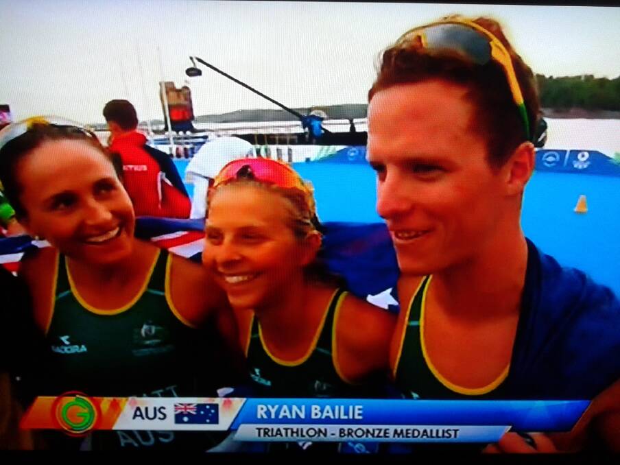Bunbury triathlete Ryan Bailie being interviewed by official broadcaster Channel 10 after winning a Commonwealth Games bronze medal in the team triathlon event. 