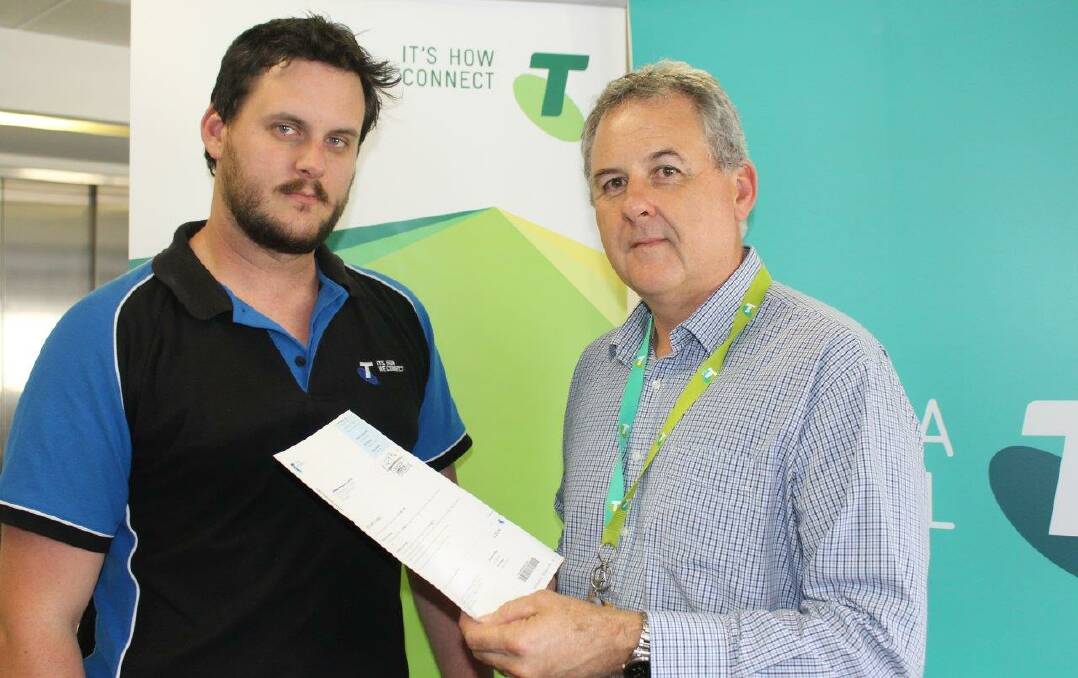 Telstra marketing specialist Cameron Edwards and area general manager Boyd Brown. 