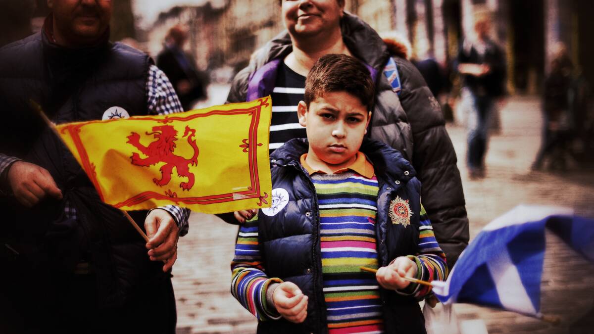 A boy holds a Saltire and Loin Rampant flag on April 23, 2014 in Edinburgh, Scotland. Pic: Jeff J Mitchell/Getty Images