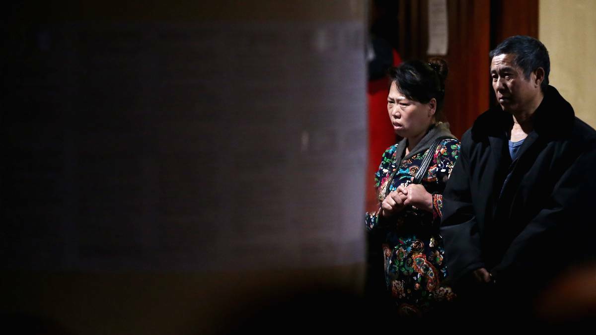 Chinese relatives of the passengers onboard Malaysia Airlines flight MH370 wait for the latest information in Beijing, China. Pic: Getty Images.