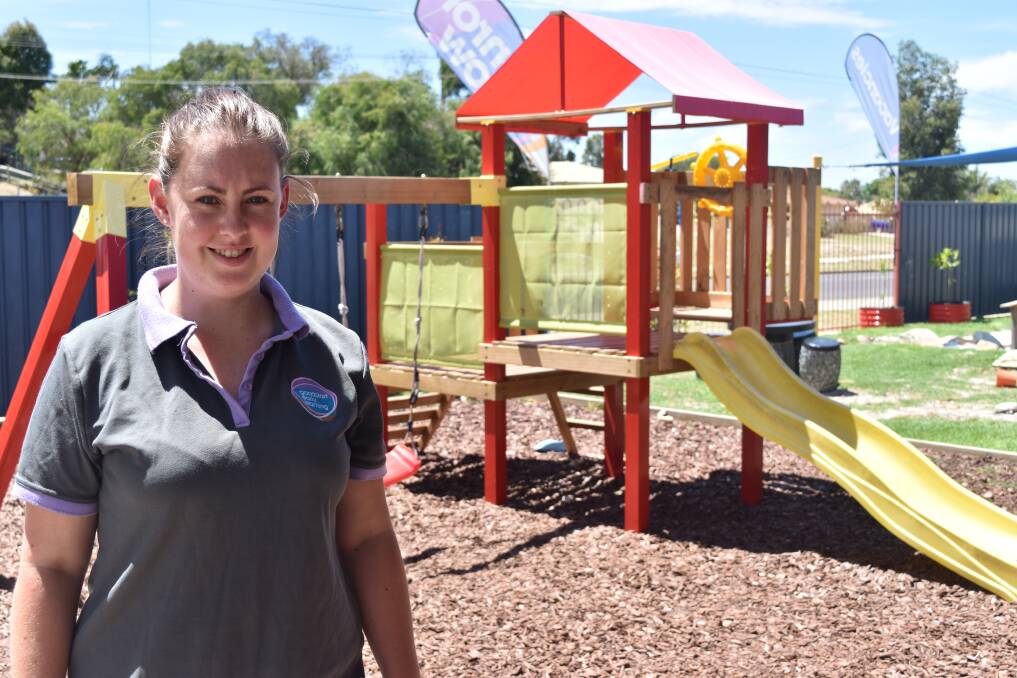 Casey Petherick in front of the Goodstart Early Learning Centre’s playground where the sustainable equipment will be stored. 