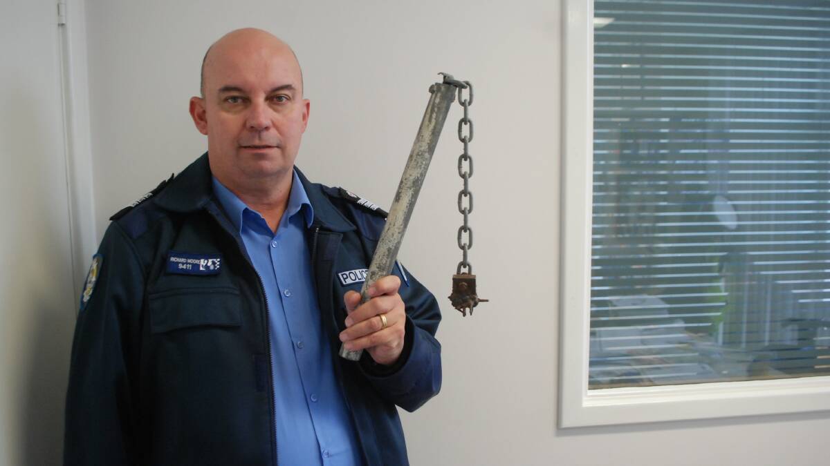 Dangerous: Esperance police officer in charge Senior Seargent Richard Moore with the confiscated weapon.