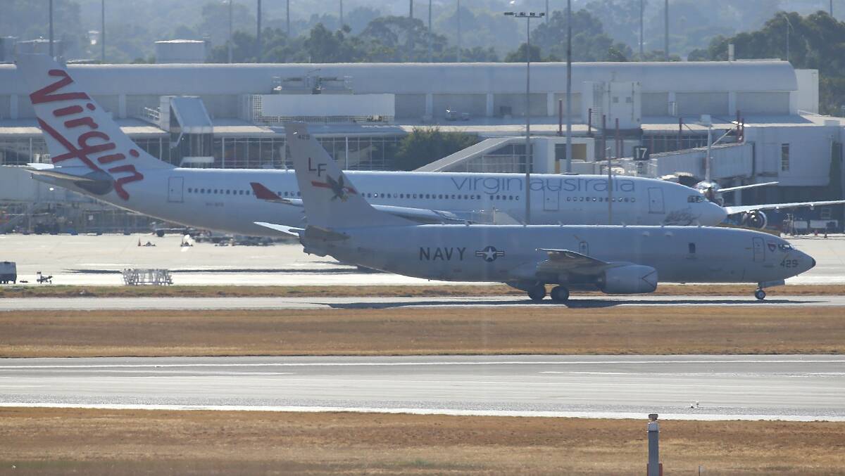 US Naval surveillance aircraft invloved in the search for the missing Malaysian Airlines flight MH370 is seen after landing at Perth airport on March 19 in perth. Photo: Getty Images.