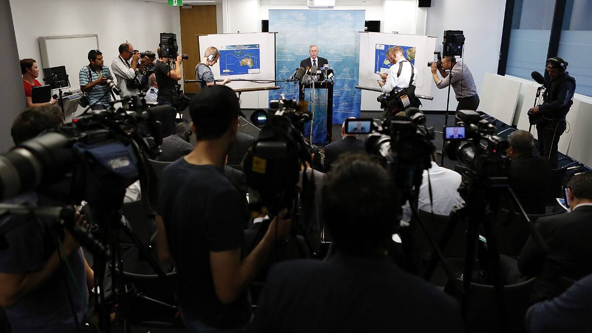 Australian Maritime Safety Authority Emergency Response Division general manager John Young speaks to the media about satellite imagery of objects possibly related to the search for Malaysian Airlines flight MH370 on March 20 in Canberra. Photo: Getty Images.