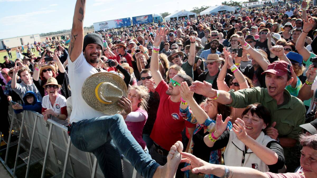 Michael Franti gets among the people on Saturday.