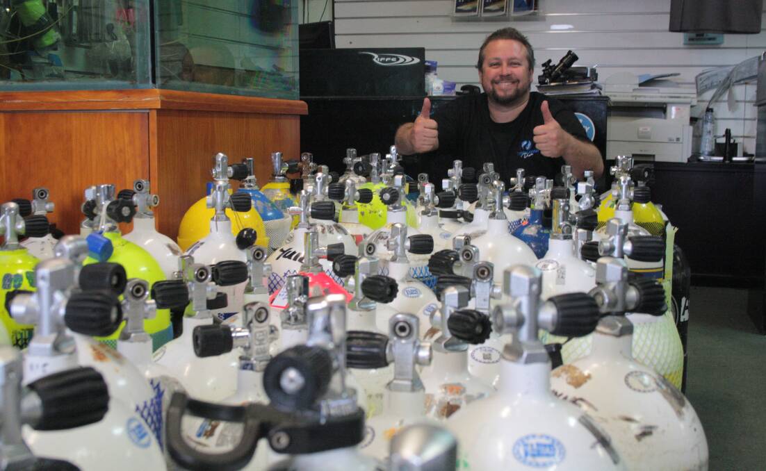 Coastal Water Dive owner Torry Goodall pulled an all-nighter filling scuba tanks on Monday, with more than 380 coming through the doors across the weekend. 