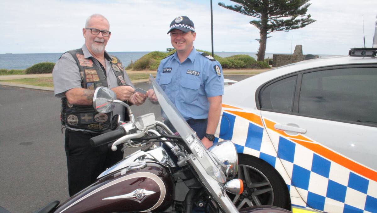 South West Traffic officer-in-charge Sergeant Craig Clarke chats to long-time Bunbury  motorbike rider Barry "Grub" Kelson. 