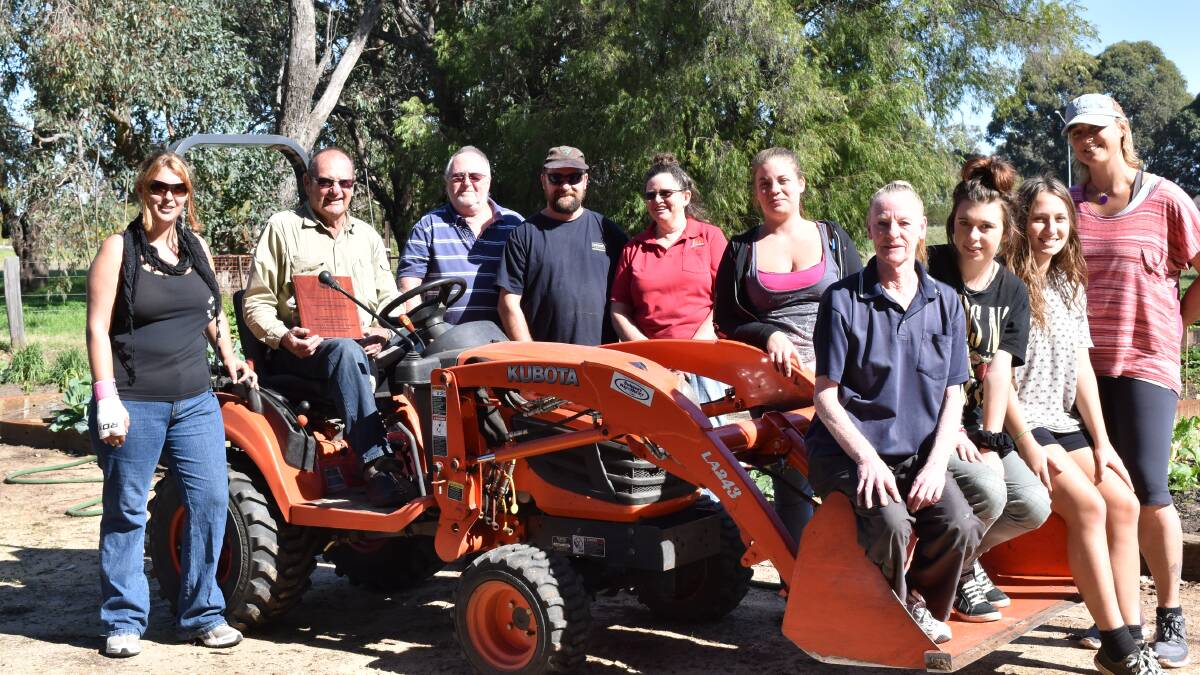 Denise and Christina Mattaboni, Bill Cox, Peter White, Bev Bristow, Vanessa Obal, Rachel Button, Amber Stanley and Anne Stevens from the JSW horticulture training program at Thommo’s Community Garden with Malcolm Robertson award winner, John Thomson. 