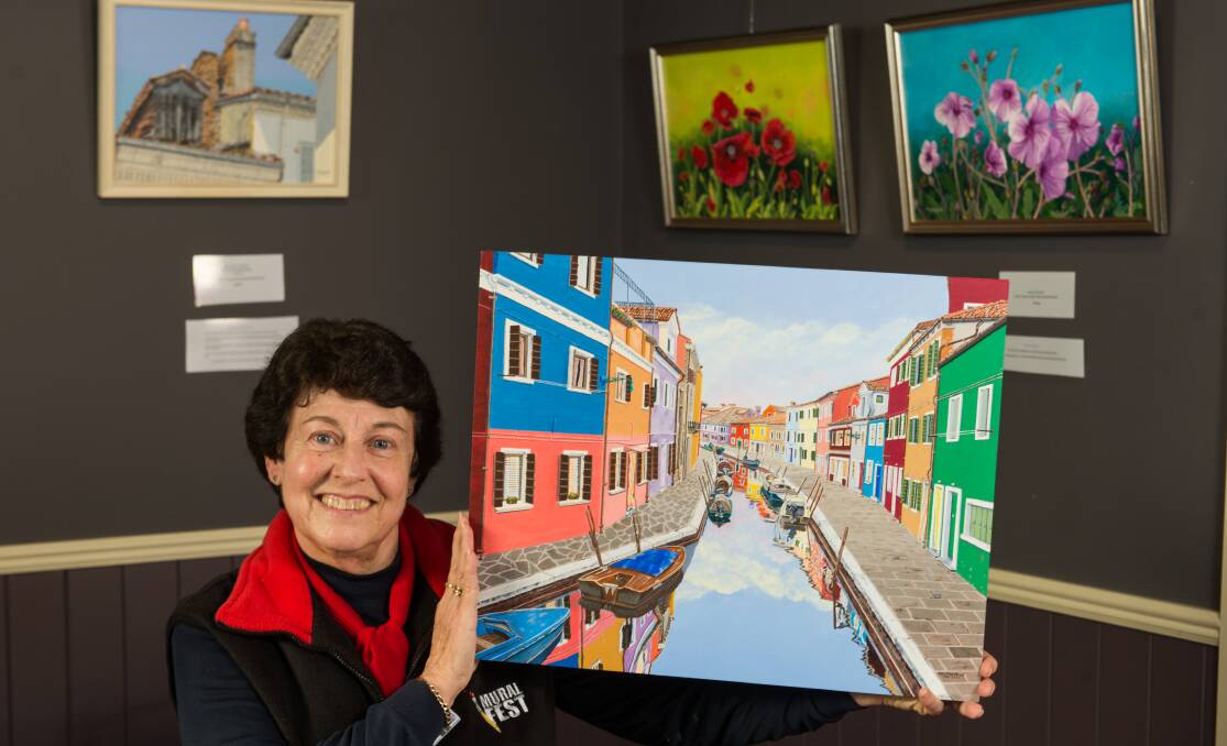 WORKS OF ART:  Mural Fest volunteer Kay Marshall has an exhibition of her own at Fudge 'n' Good Coffee until April 30. Picture: Phillip Biggs.