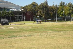 Police investigate the stabbing at the South West Sports Centre.