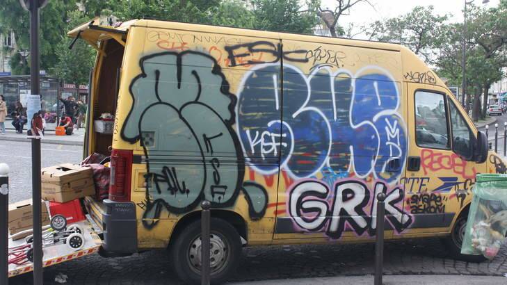 A graffitied van in Paris.
