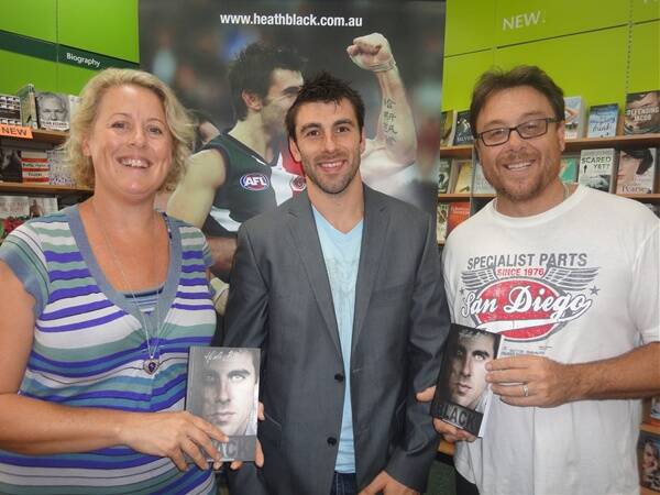 RadioWest presenter Cliff Reeve couldn’t wait to buy Heath Black’s memoirs Black on Monday afternoon. Pictured with the pair is co-author Lisa Holland-McNair.