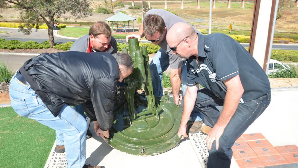 Cheering: Tony Abbondandolo, Andrew McDonald, Peter Dornhardt and Paul Bryan return the stolen mortar to pride of place in front of the Murray Bridge RSL.