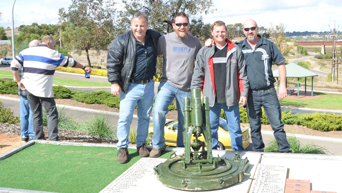 Cheering: Tony Abbondandolo, Andrew McDonald, Peter Dornhardt and Paul Bryan return the stolen mortar to pride of place in front of the Murray Bridge RSL.