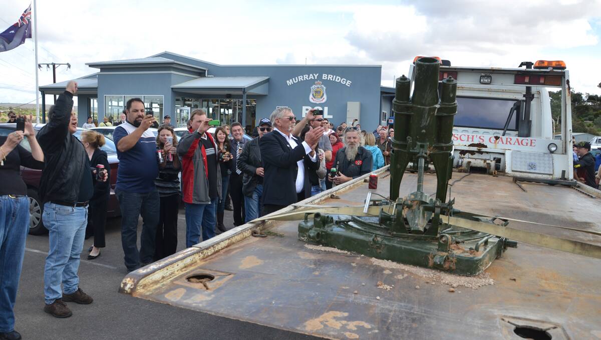 Three cheers: An overjoyed crowd at the Murray Bridge RSL welcomed back the stolen WWI mortar. 