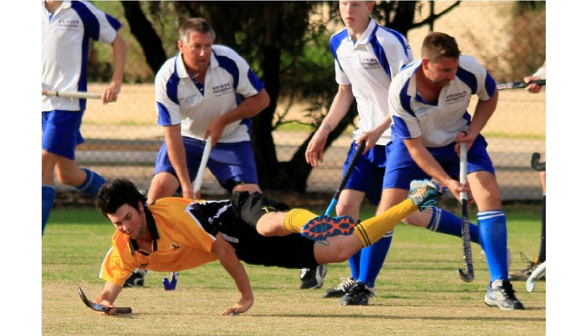 The Greater Wheatbelt Men's Hockey Association has produced some great games as each team compete for the top four spots in time for finals, here Kellerberrin's Steve Gregory traps the ball in defence as Corrigin's Michael Butler flies through the air. Photo: Merredin-Wheatbelt Mercury.