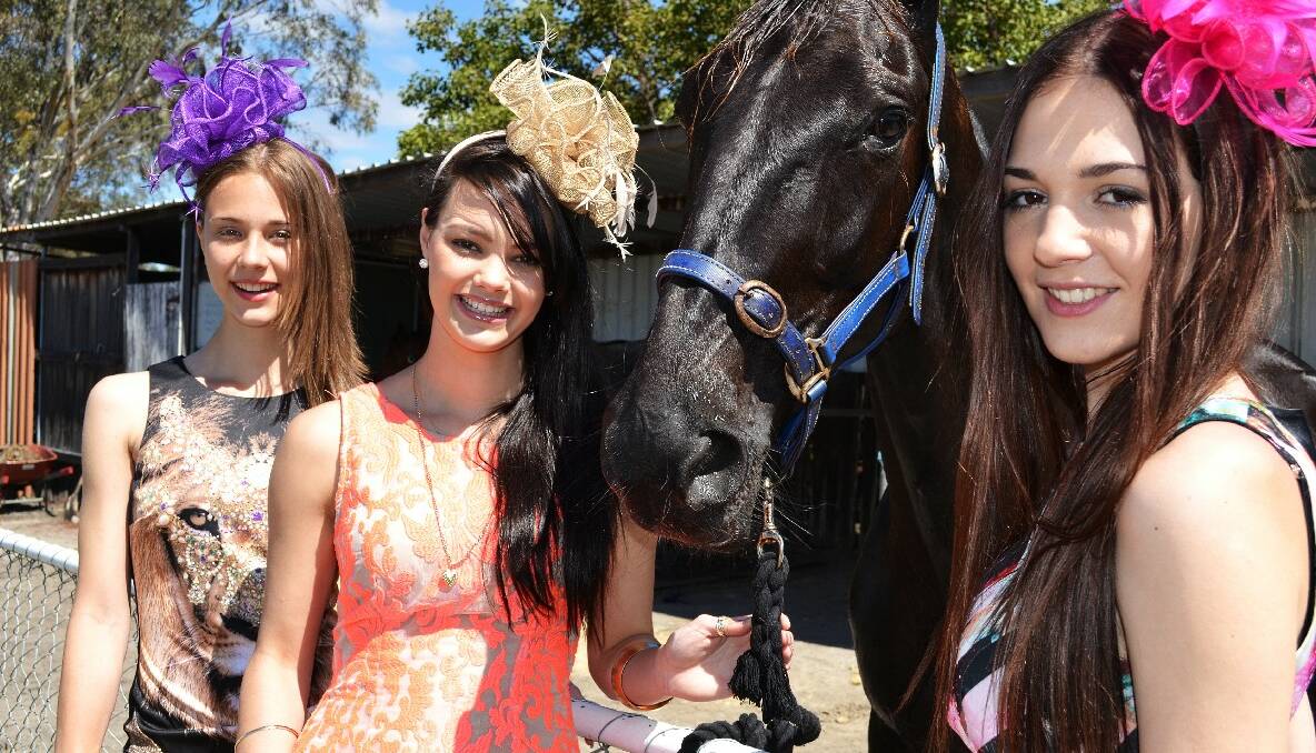 Kira Bebbington, Grace Andretta and Rebecca Lockyear preparing for this weekend's Collie Cup and Fashions on the Fields. Photo: Collie Mail.