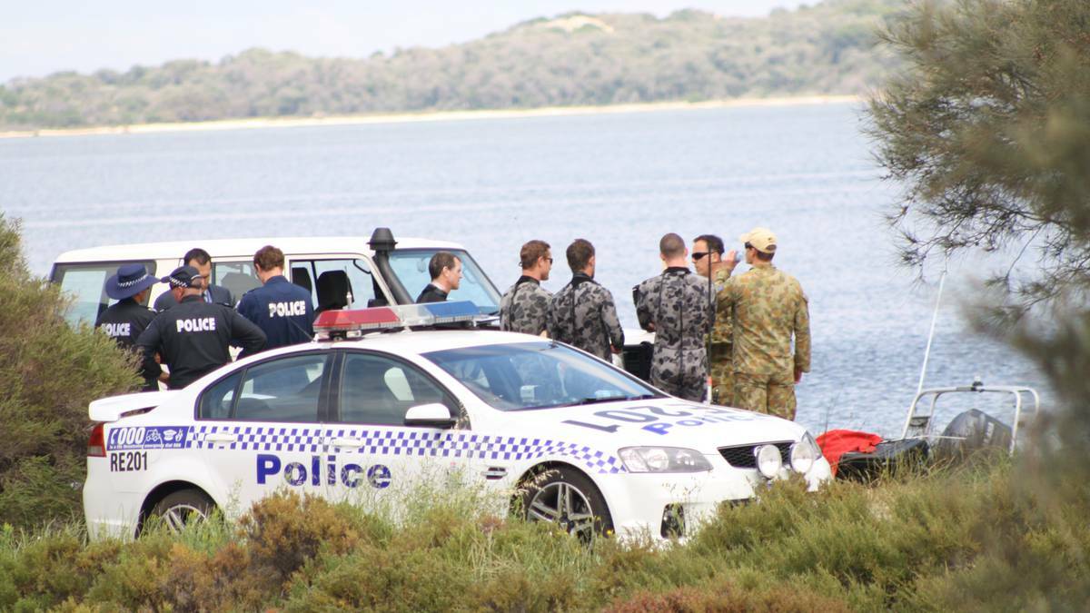 Police and defence force personel continue to scour the estuary in Australind. Photo: Andrew Elstermann.