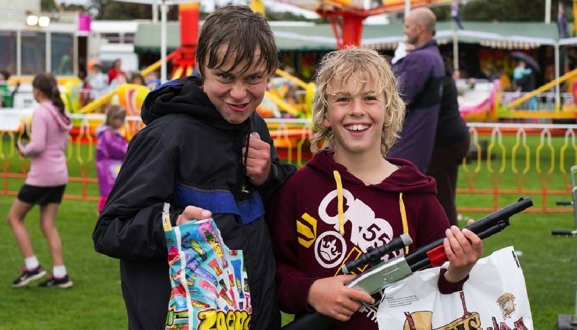 Lucas May and Connor Barrett-Lennard delve into their Margaret River ag show showbags. Photo by Sandy Powell.