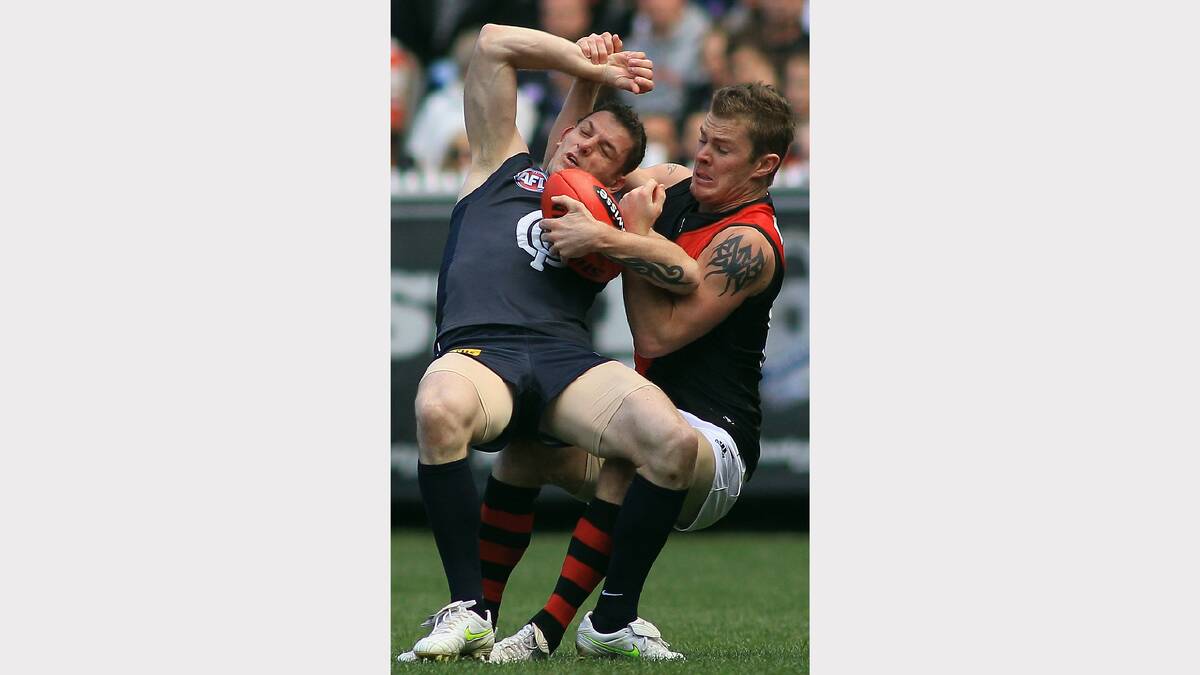Kyle Reimers tackling Heath Scotland in the 2011 preliminary final.