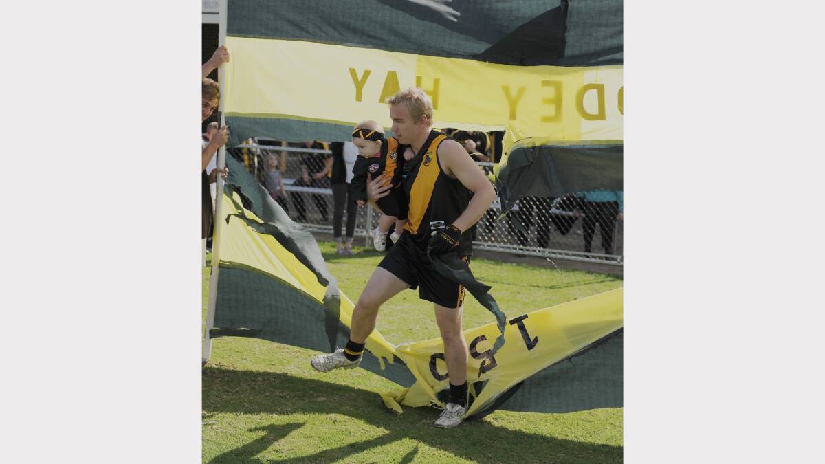 Bunbury's Codey Hay ran lead the team through the banner for his 150th game. Photo by Ted May.