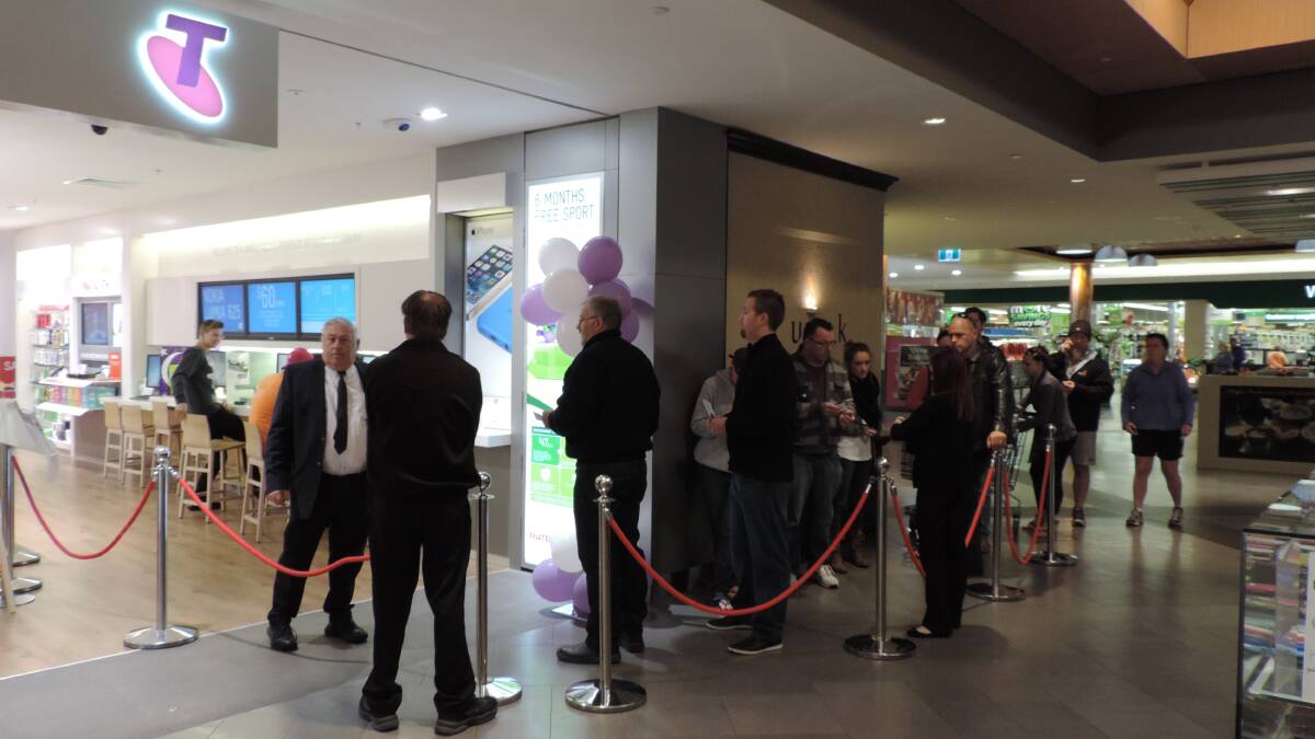 Customers lining up to be the first in Bunbury to have the new Iphone launched on Friday morning. 