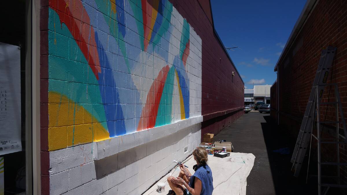 Anya Brock injects colour into the Shoe-Be-Doo wall on Stirling Street. 