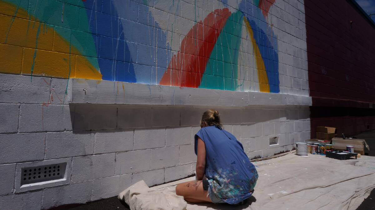 Anya Brock injects colour into the Shoe-Be-Doo wall on Stirling Street. 