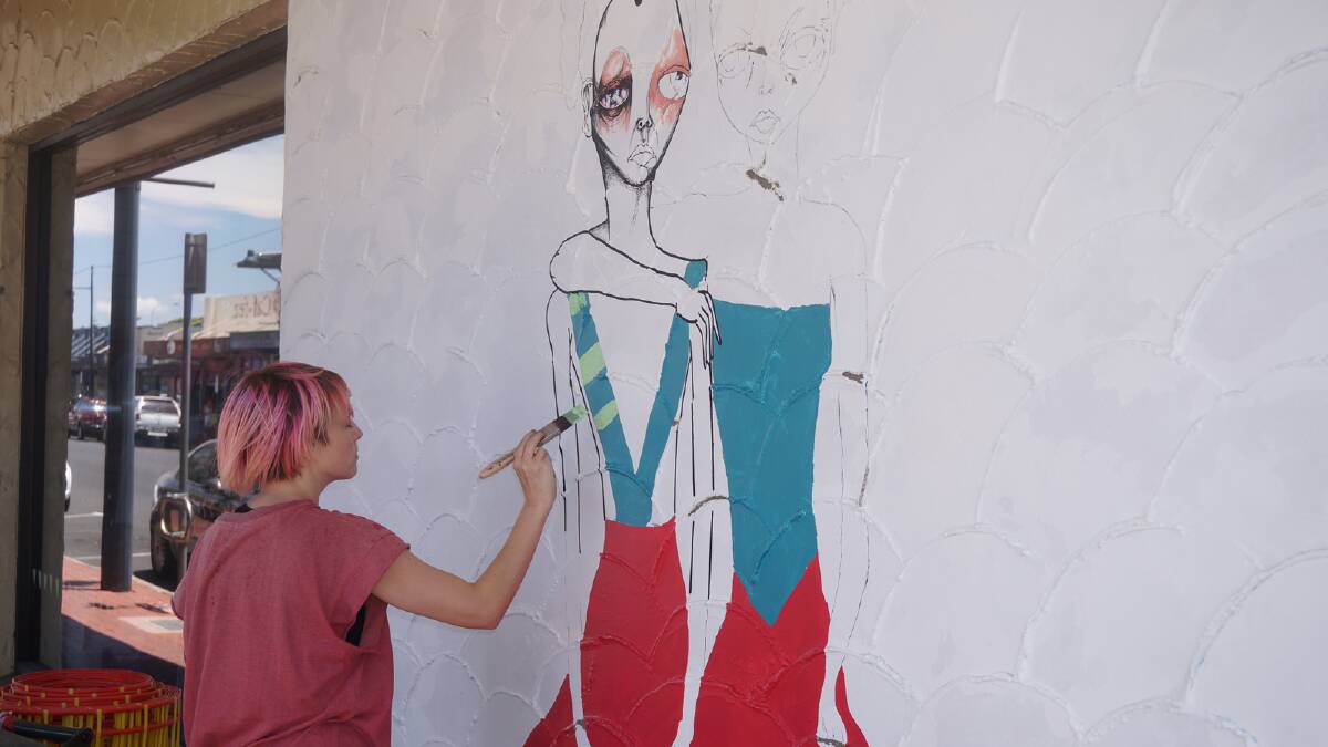 Jodee Knowles gets her creative juices flowing on The Wombat Lodge's wall on Prinsep Street. 
