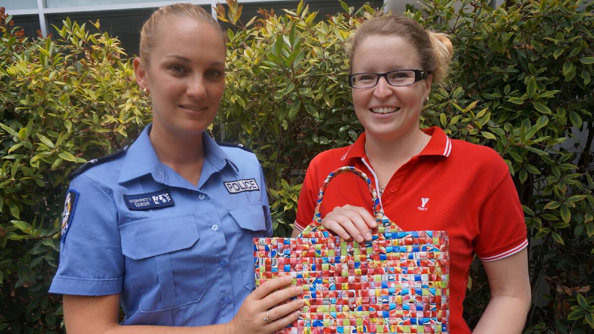 First class constable Taryn Werrett returned Chloey Dougheney's stolen handbag today, which contained precious photos of her five-year-old boy who passed away in 2011. 