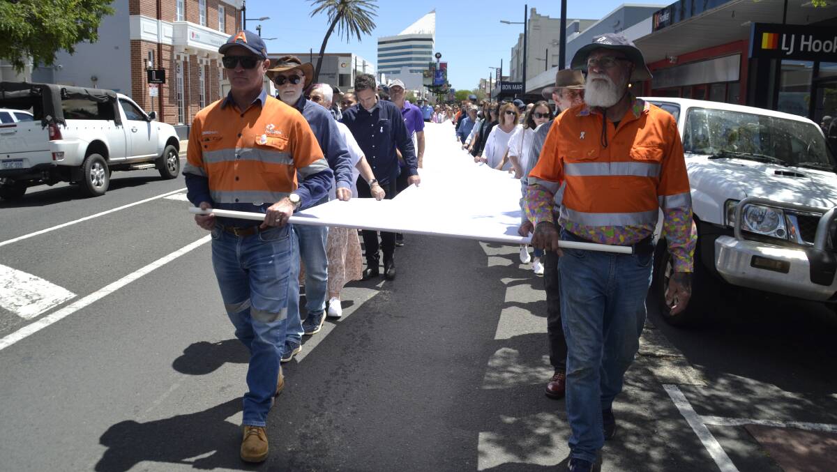 The 'white ribbon': Hundreds of supporters carried the ribbon from the Bunbury Regional Art Gallery through to ANZAC Park. Picture: Pip Waller. 
