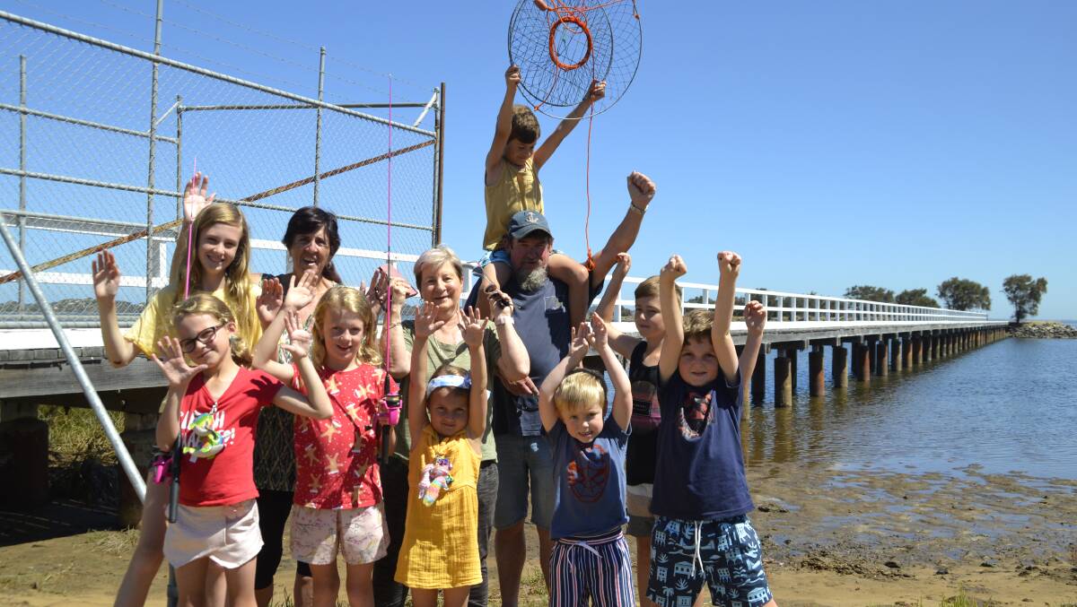Funding celebrated: Lorraine McDonald and Mick and Rozanne Crosby in December 2021 with their grandchildren, Tayla, Kadence, Tom, Brooklyn, Jake, Madison, Jack and Liam. Picture: Pip Waller 