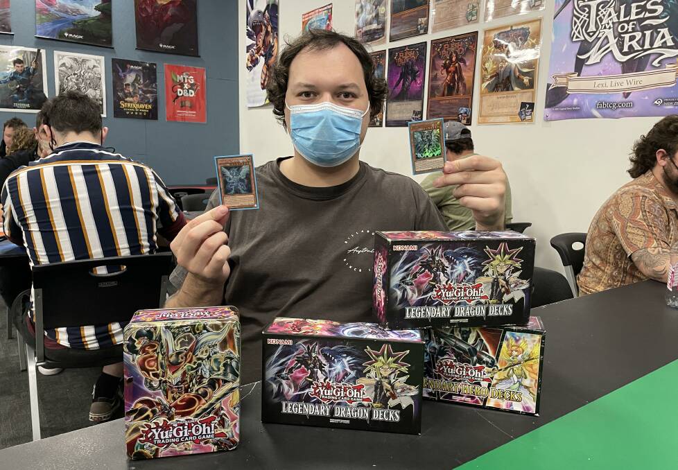 Yu-Gi-Oh showdown: Player Nathan showing off his huge collection of trading cards, with some valued at $120. Picture: Pip Waller 