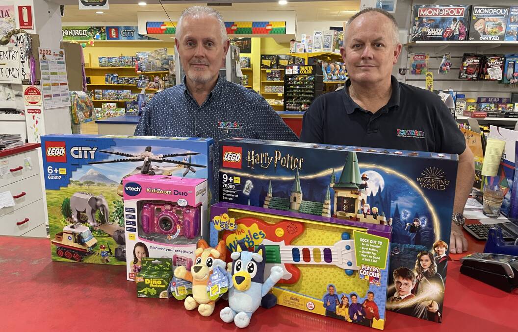 Thankful for 'Secret Santa': Toyworld Bunbury owners and brothers, Harvey and Rick Baker, thanked the anonymous man who paid off over $13,000 worth of lay-bys in December. Picture: Pip Waller 
